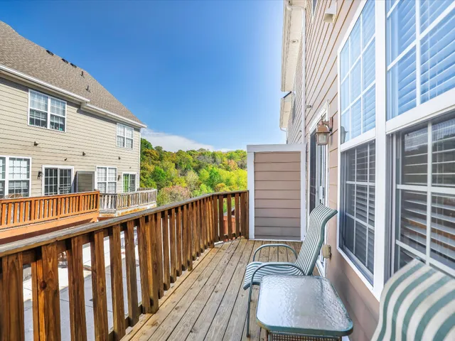 an aerial view of multiple houses with yard
