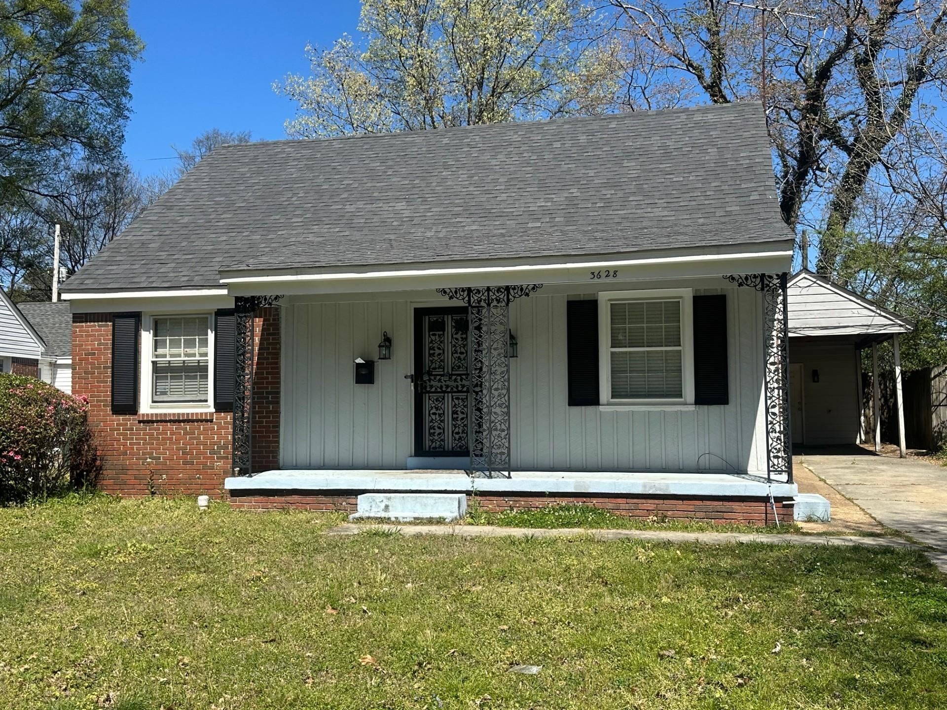 3628 Carrington Road Memphis, TN 38111 - Photo 1 of 15 View of front of property featuring covered porch, a front lawn, an attached carport, and a shingled roof