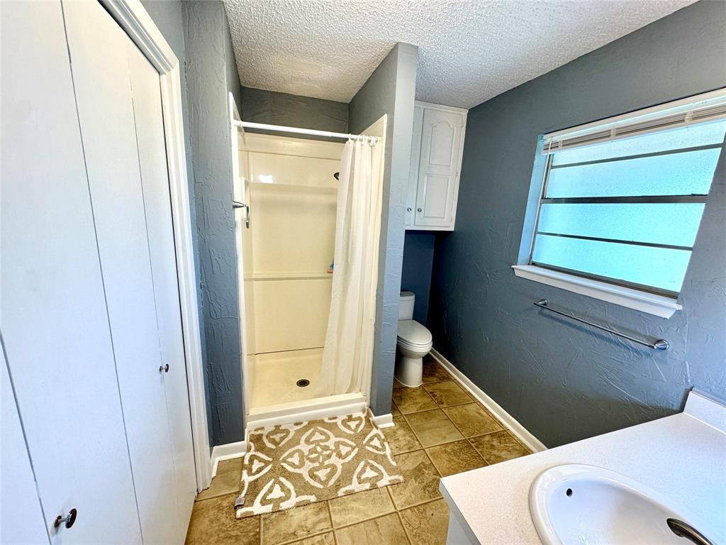 4170 Farm To Market 51 Decatur, TX 76234 - Photo 21 of 36 a bathroom with a sink and a toilet