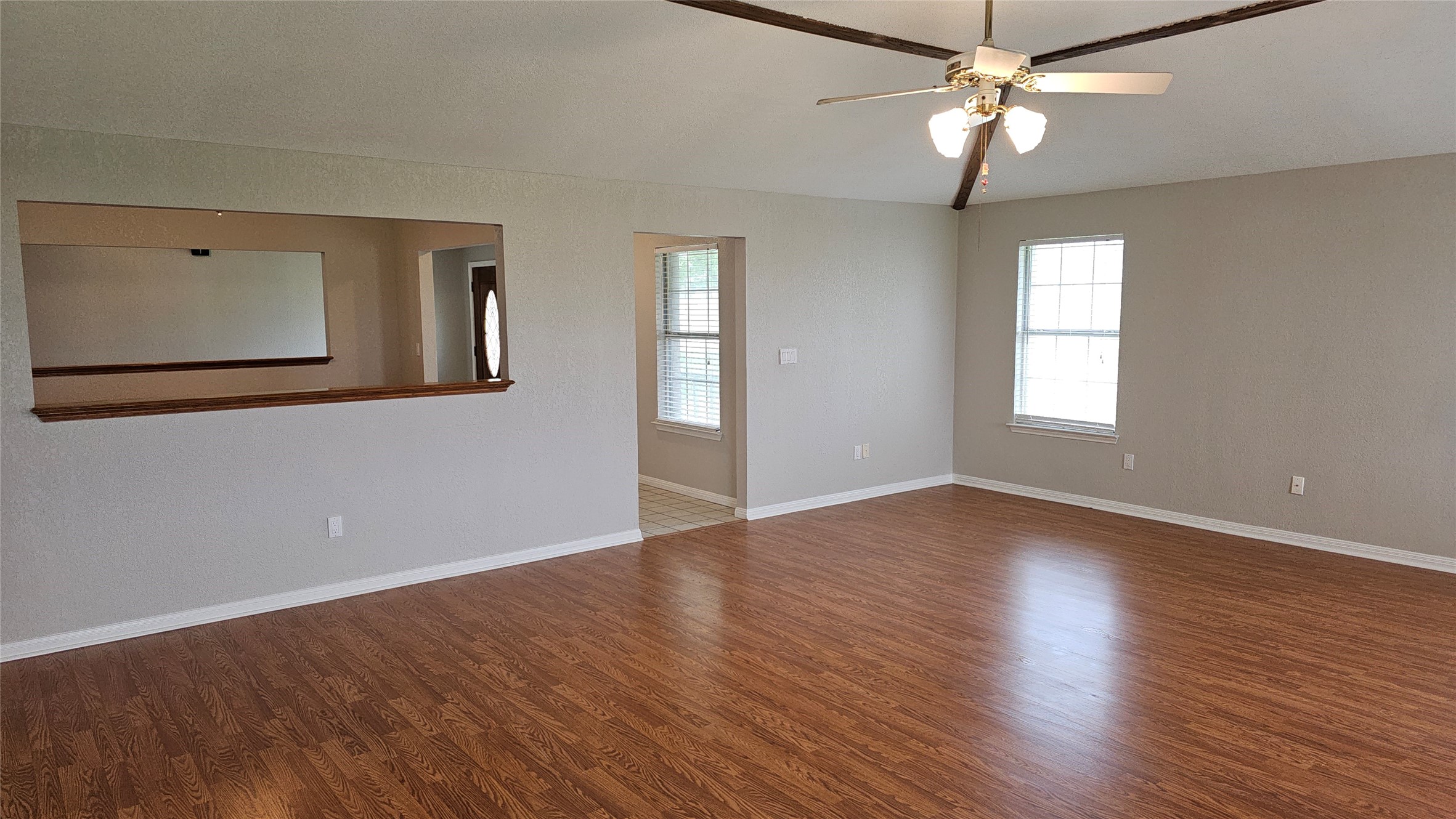 16 Brenda Lane Round Rock, TX 78665 - Photo 11 of 40 a view of an empty room with wooden floor and a window