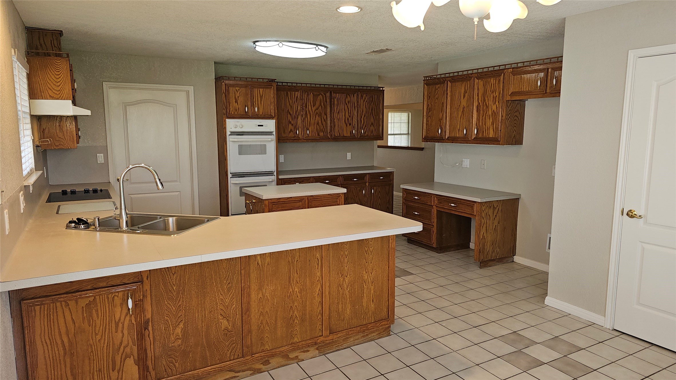 16 Brenda Lane Round Rock, TX 78665 - Photo 17 of 40 a kitchen with stainless steel appliances a sink and a refrigerator
