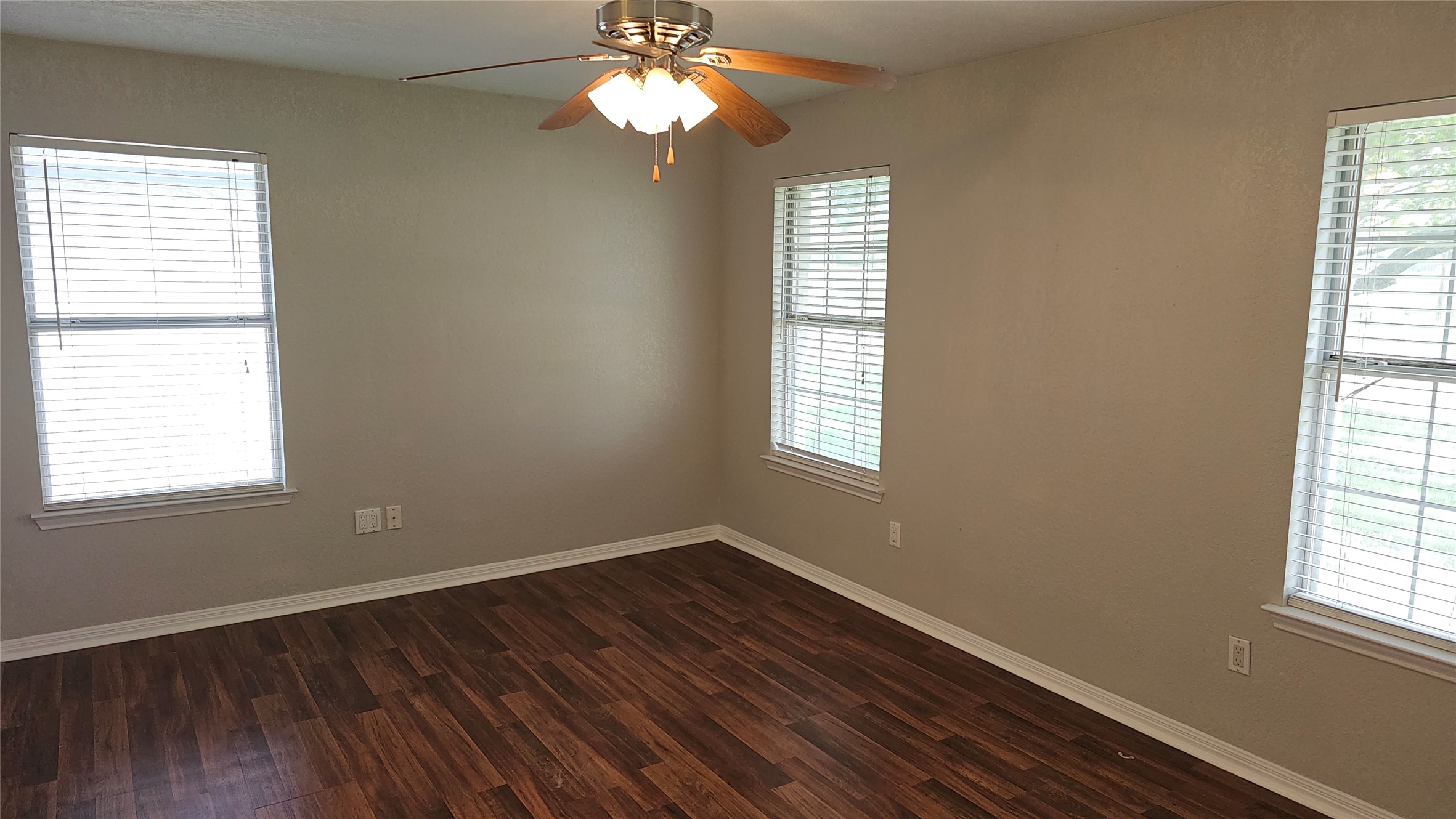 16 Brenda Lane Round Rock, TX 78665 - Photo 22 of 40 a view of an empty room with wooden floor and a window