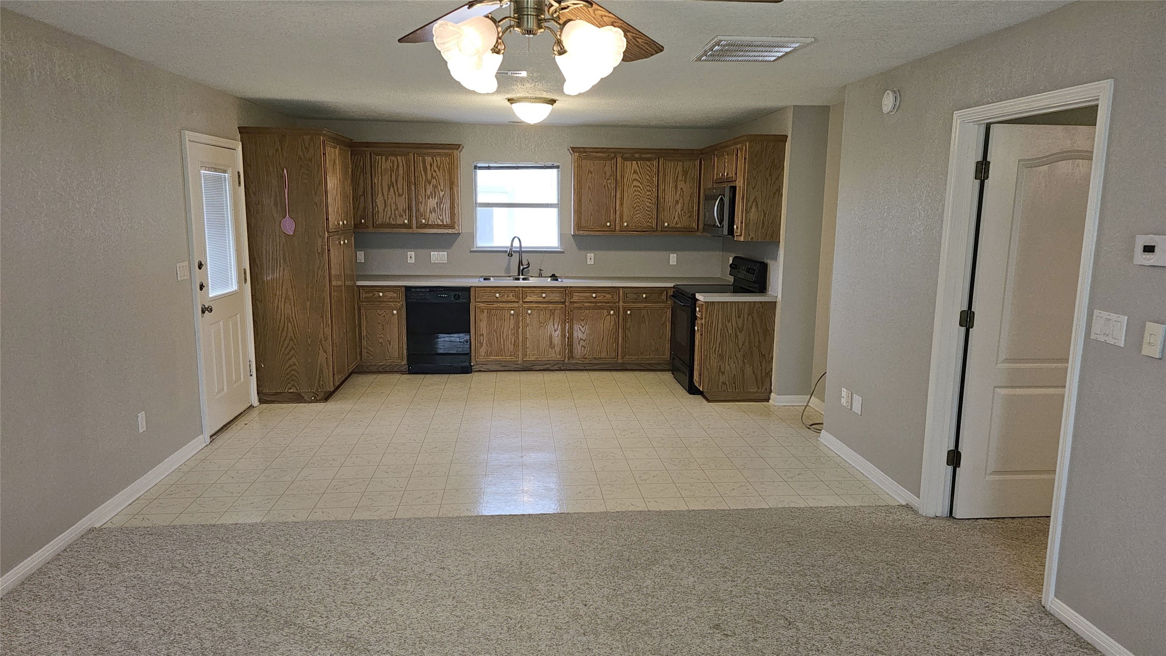 16 Brenda Lane Round Rock, TX 78665 - Photo 31 of 40 a large kitchen with a large window and stainless steel appliances