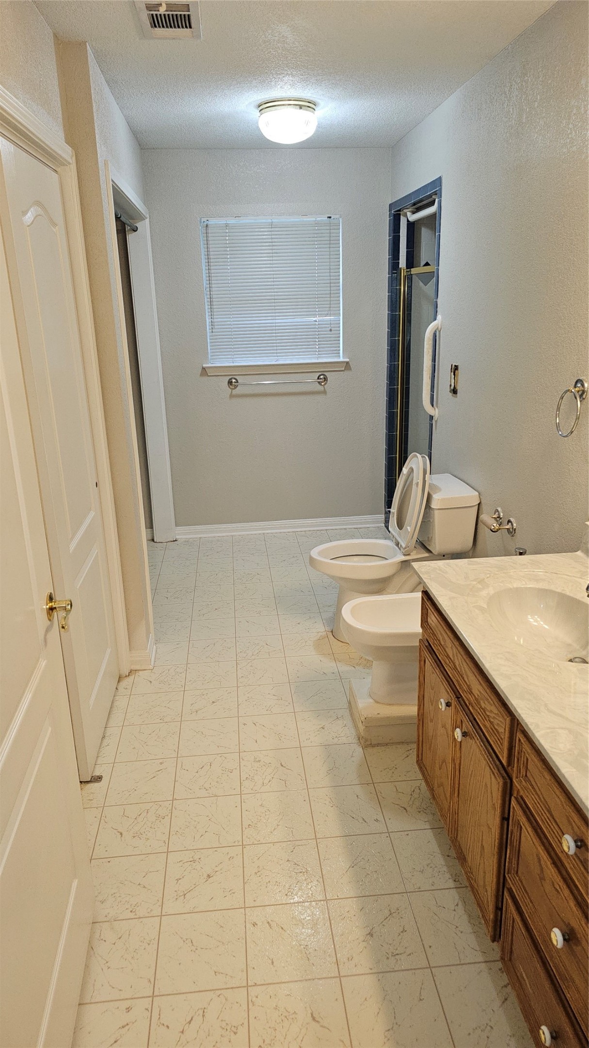 16 Brenda Lane Round Rock, TX 78665 - Photo 34 of 40 a bathroom with a granite countertop sink a toilet and a mirror
