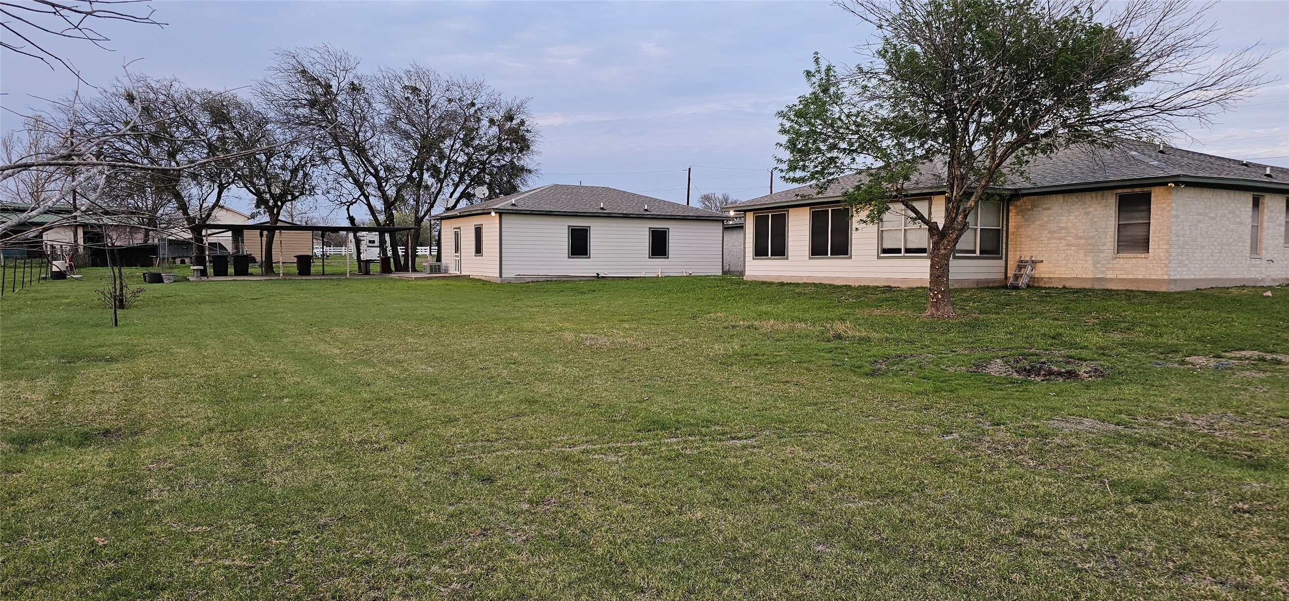 16 Brenda Lane Round Rock, TX 78665 - Photo 9 of 40 a view of a yard in front of a house with large trees