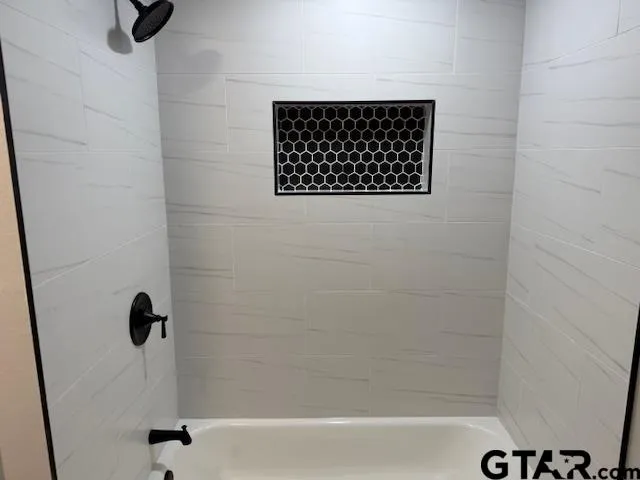 a bathroom with a double vanity sink and mirror