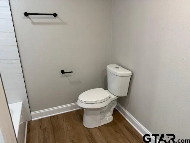 an empty room with wooden floor