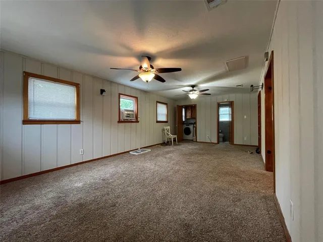 a view of a hallway with windows