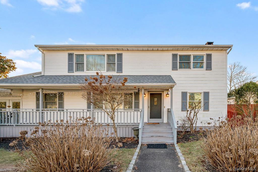 a front view of a house with a porch