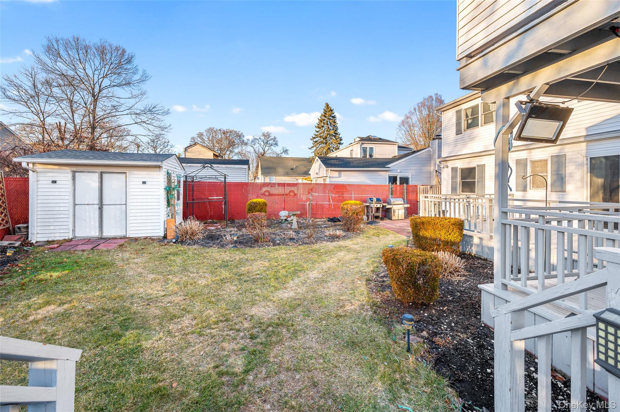 8 George Drive Mastic, NY 11950 - Photo 11 of 30 a front view of a house with a yard