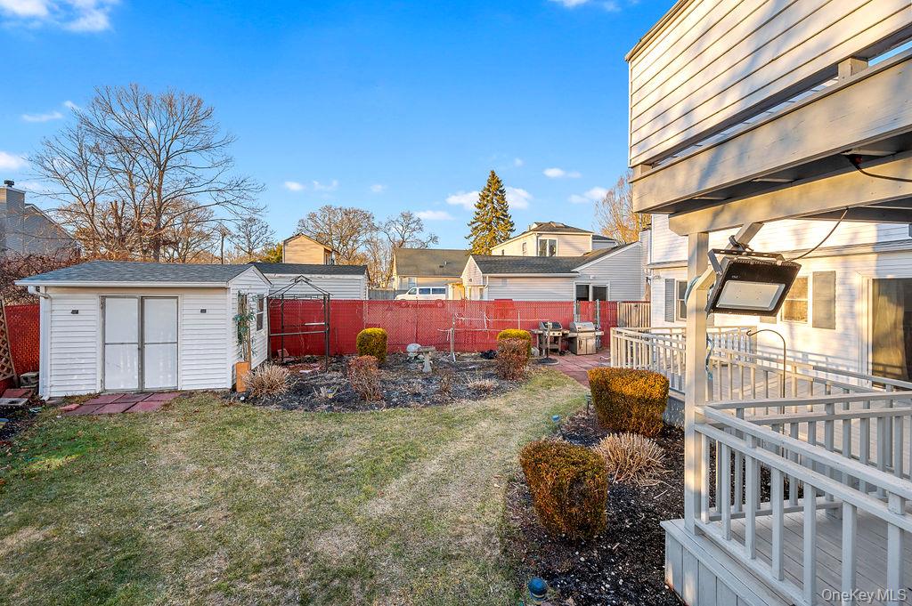 8 George Drive Mastic, NY 11950 - Photo 12 of 39 a view of a houses with backyard