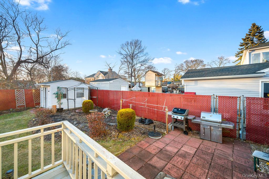 8 George Drive Mastic, NY 11950 - Photo 13 of 39 a view of a backyard with sitting area
