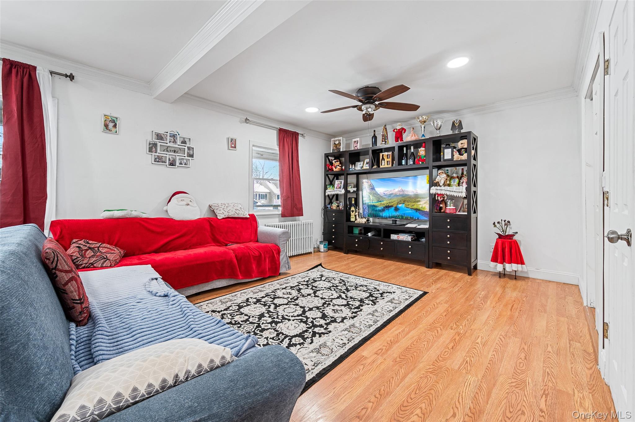 8 George Drive Mastic, NY 11950 - Photo 14 of 30 a living room with furniture and a flat screen tv