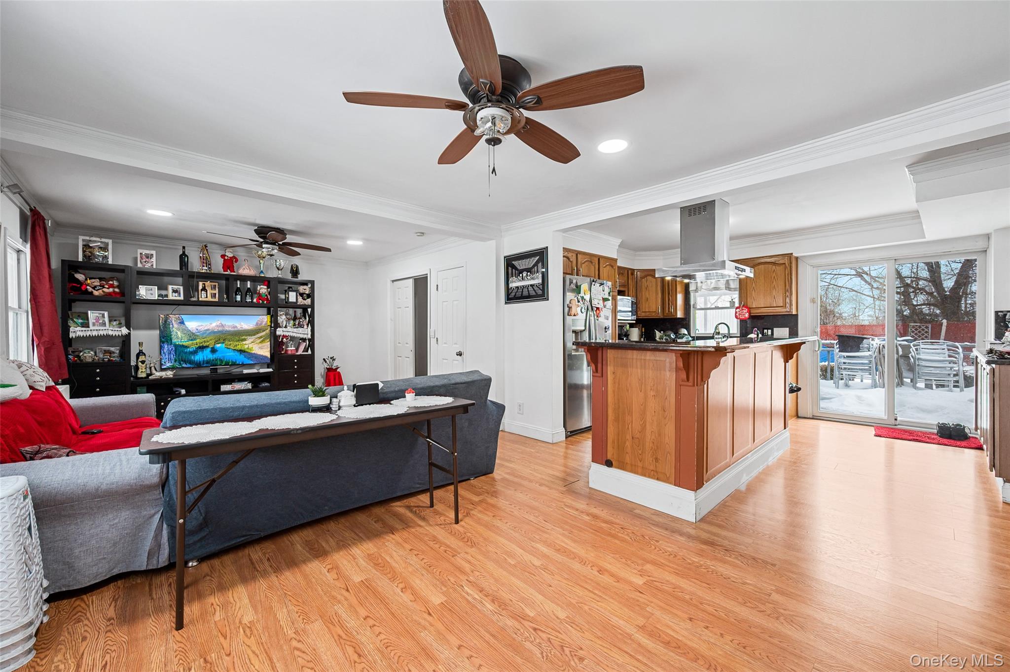 8 George Drive Mastic, NY 11950 - Photo 16 of 30 a living room with furniture and kitchen view