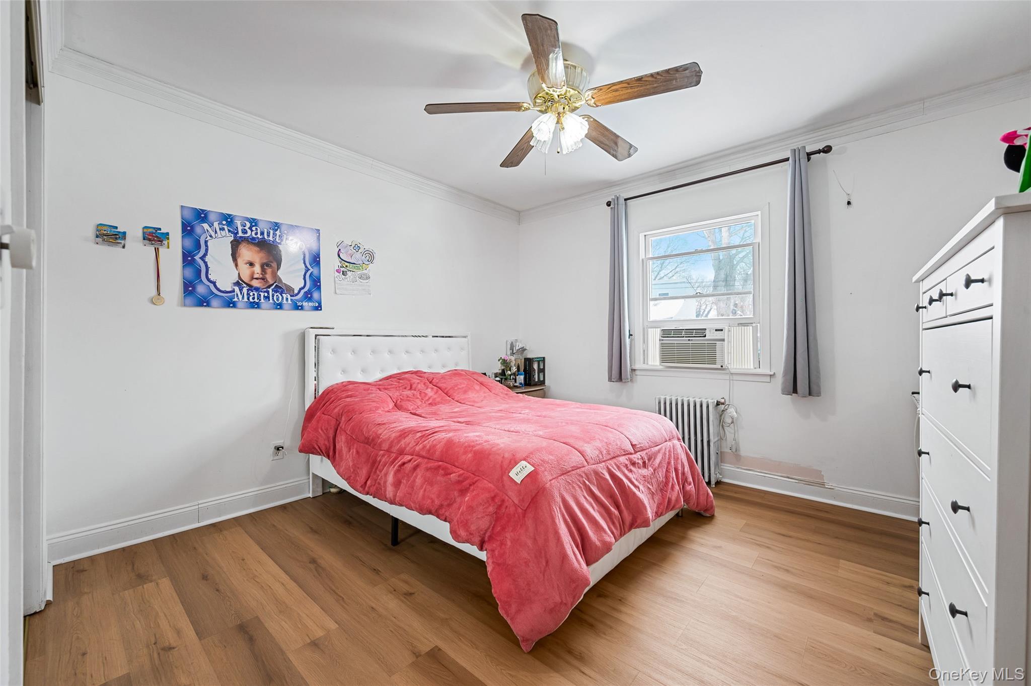 8 George Drive Mastic, NY 11950 - Photo 19 of 30 a bedroom with a bed and a window