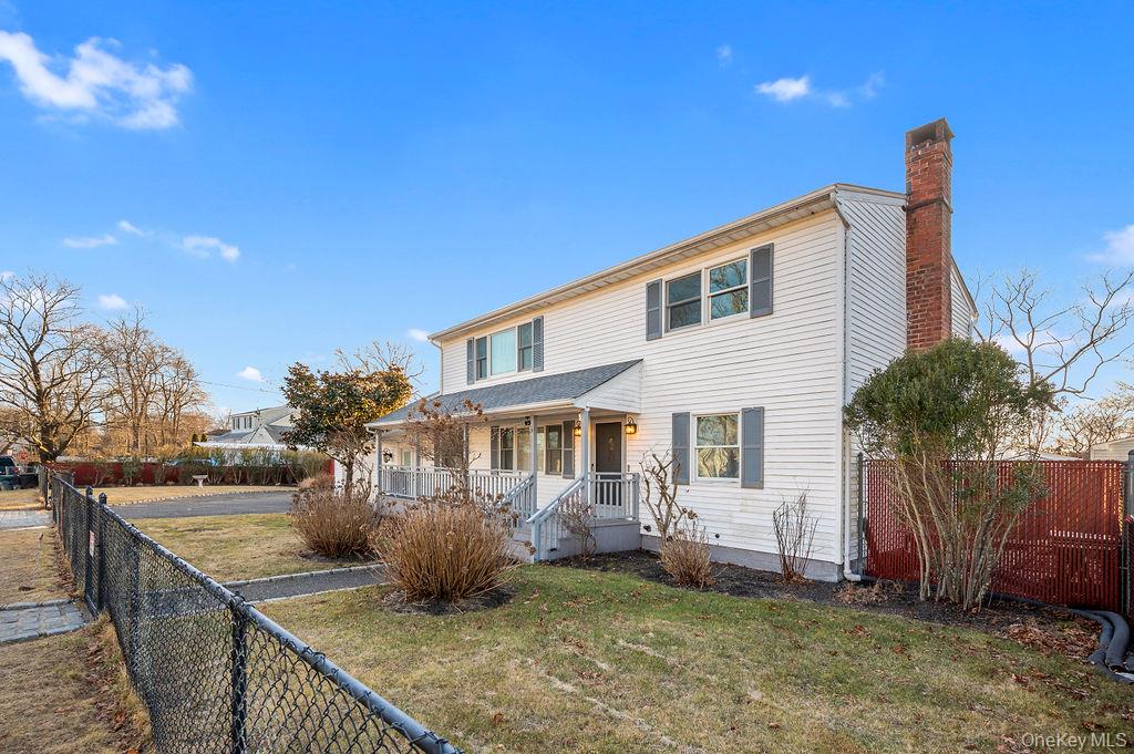 8 George Drive Mastic, NY 11950 - Photo 2 of 39 a view of a house with a patio