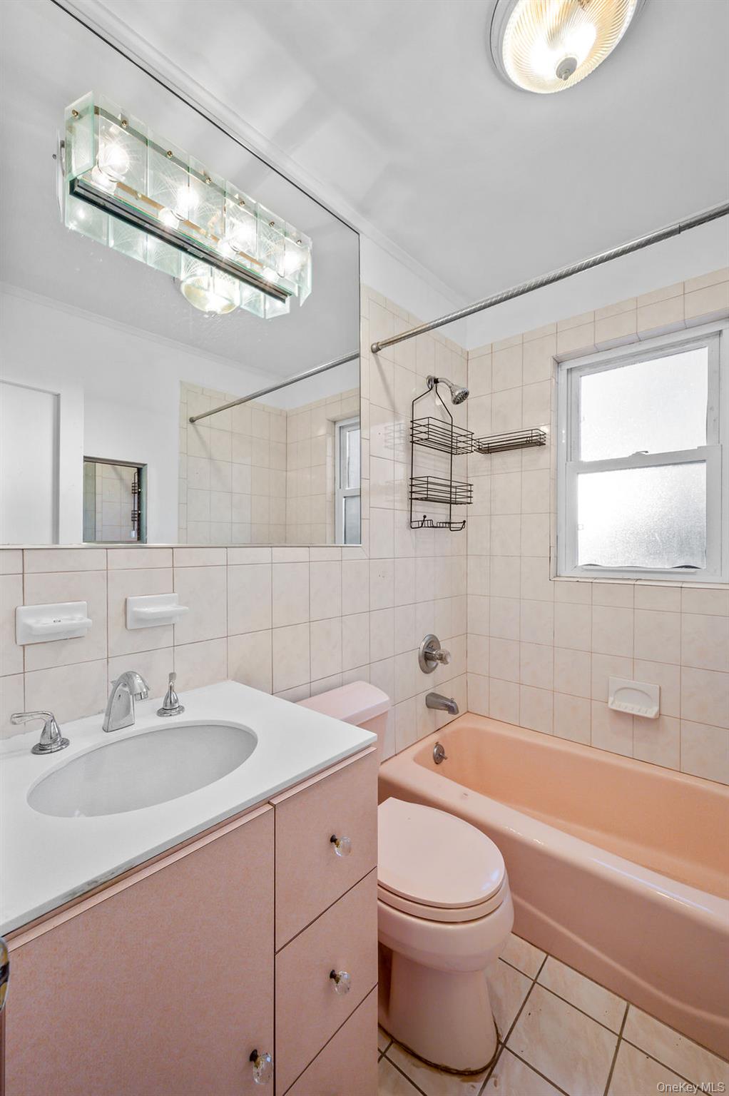 8 George Drive Mastic, NY 11950 - Photo 21 of 39 a bathroom with a sink a toilet and bathtub