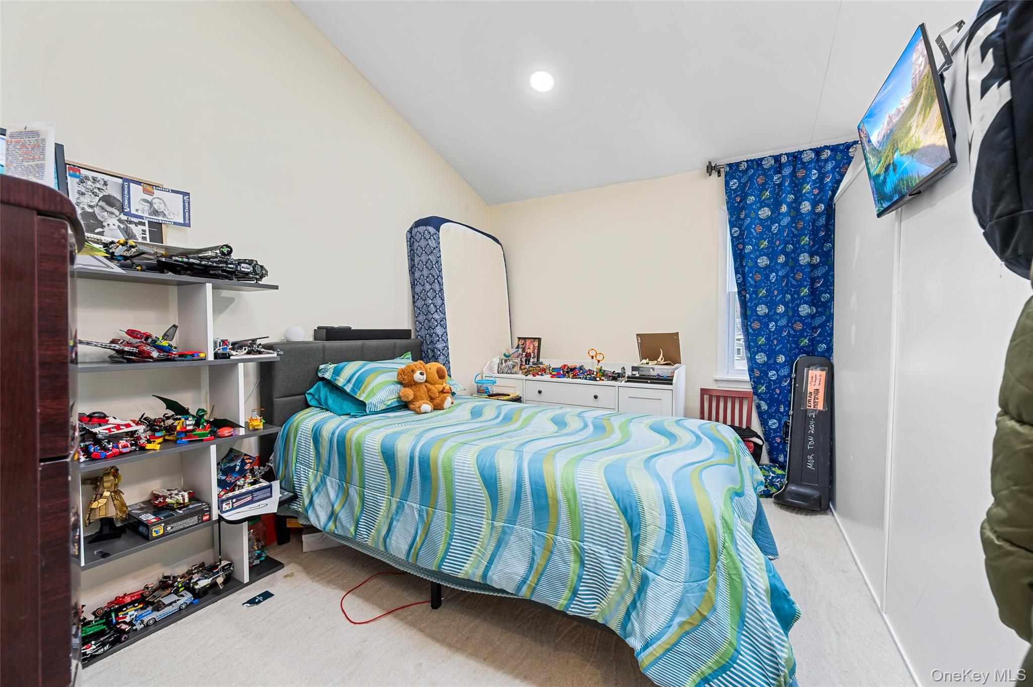 8 George Drive Mastic, NY 11950 - Photo 26 of 30 a bedroom with bed and a painting on the wall