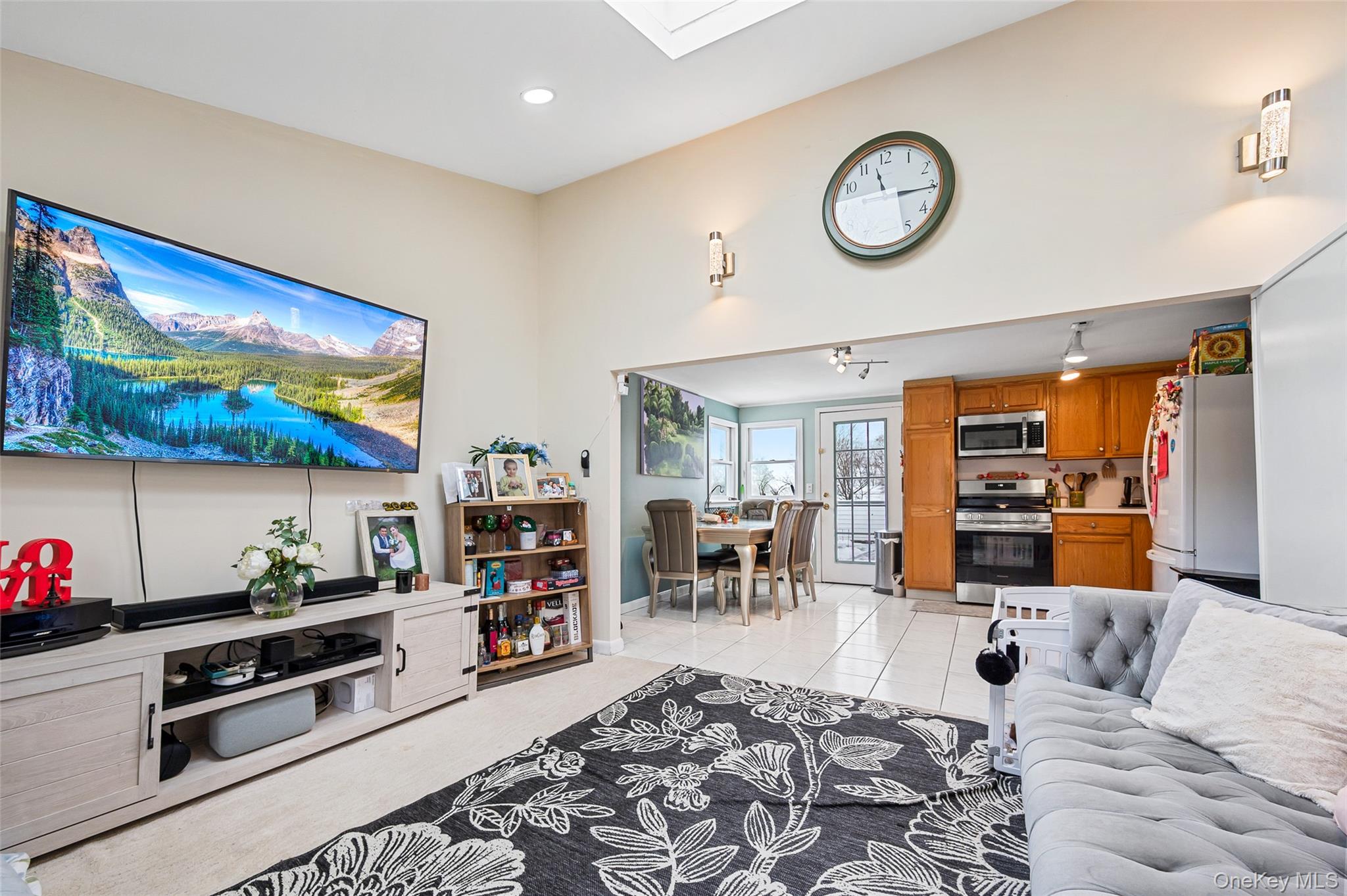 8 George Drive Mastic, NY 11950 - Photo 29 of 30 a living room with furniture and a flat screen tv