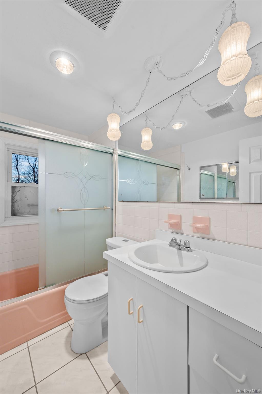 8 George Drive Mastic, NY 11950 - Photo 34 of 39 a bathroom with a sink a toilet and mirror