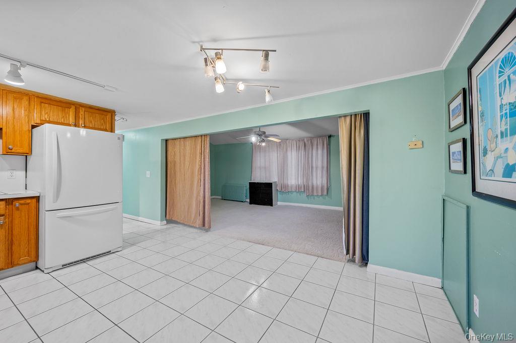 8 George Drive Mastic, NY 11950 - Photo 36 of 39 a view of a kitchen with refrigerator and cabinet