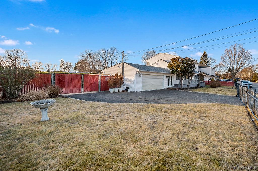 8 George Drive Mastic, NY 11950 - Photo 4 of 39 a view of backyard of the house