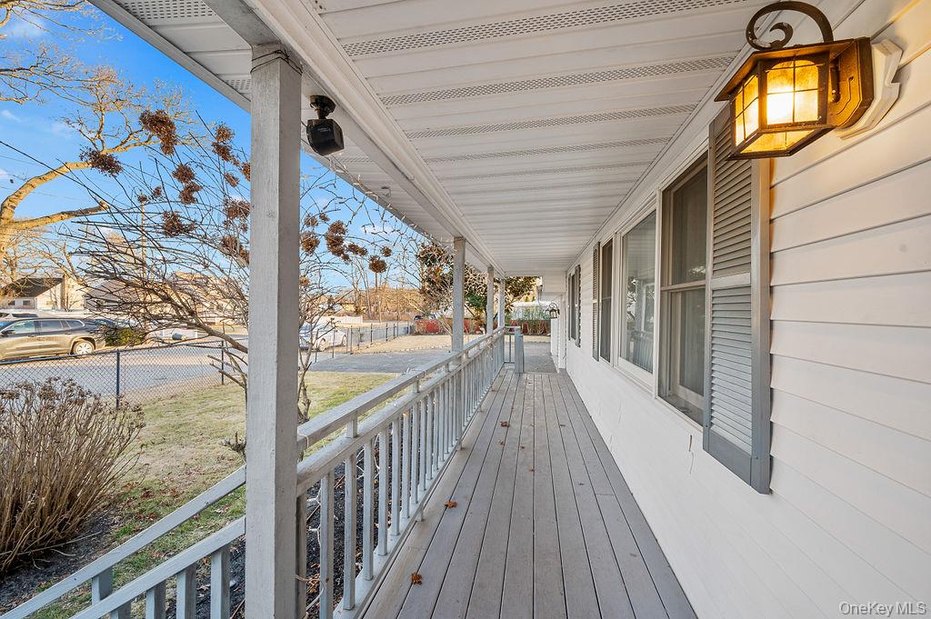 8 George Drive Mastic, NY 11950 - Photo 5 of 39 a view of a balcony with wooden floor
