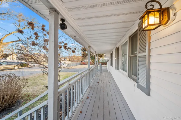 a view of a balcony with wooden floor