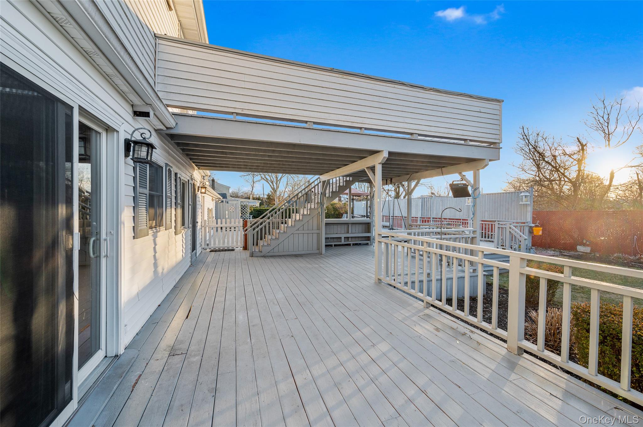 8 George Drive Mastic, NY 11950 - Photo 9 of 30 a view of a balcony with wooden floor