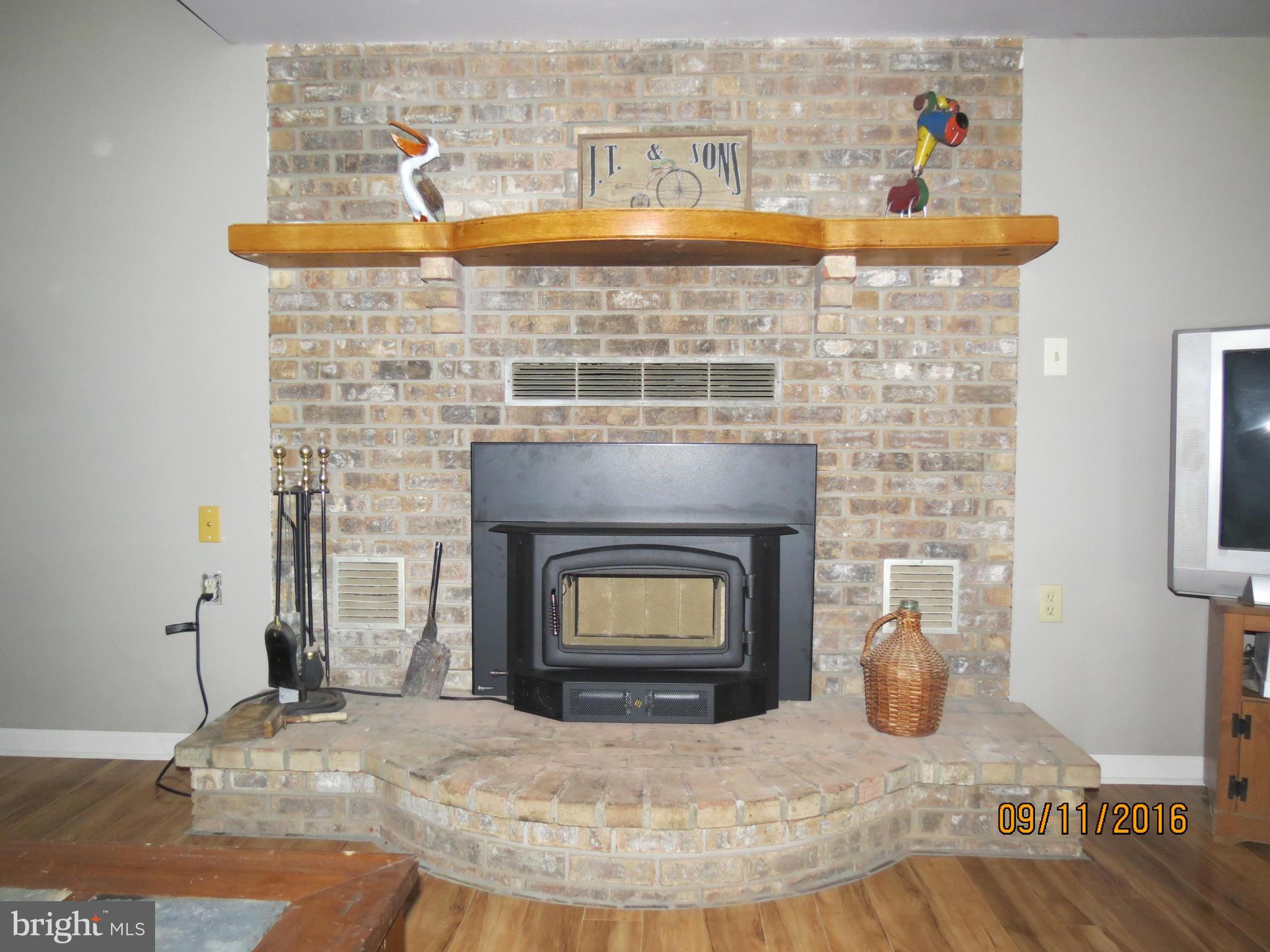 2017 Garrett Road Manchester, MD 21102 - Photo 22 of 30 8' Brick Hearth with NEW Wood Stove