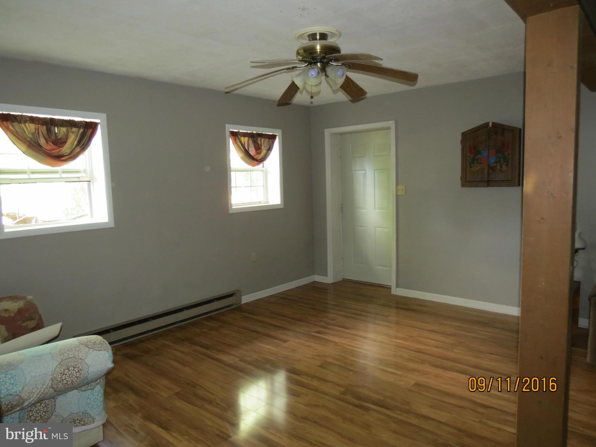 2017 Garrett Road Manchester, MD 21102 - Photo 23 of 30 Lot of Light in Family Room with Door to Work Shop