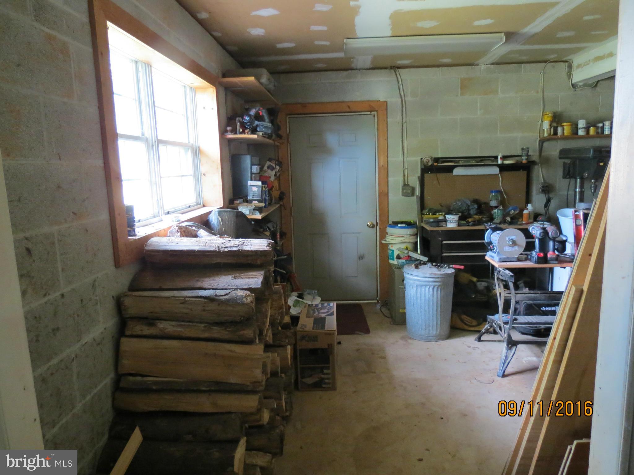 2017 Garrett Road Manchester, MD 21102 - Photo 24 of 30 Workshop with cement floor, and garage door