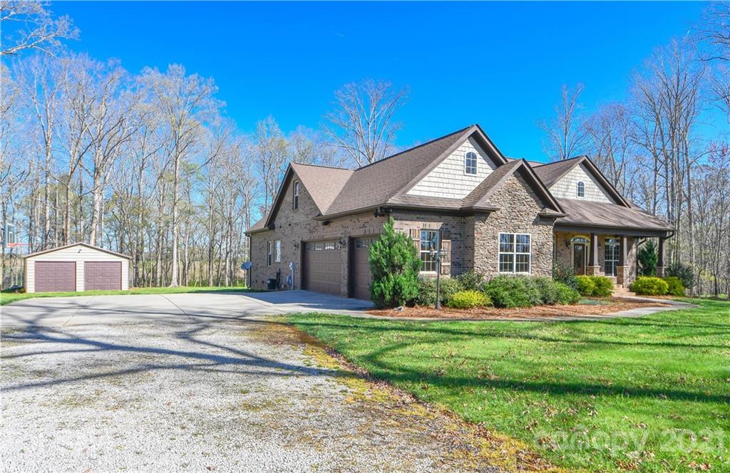 721 Roy Kindley Road Monroe, NC 28110 - Photo 2 of 32 a front view of a house with a yard