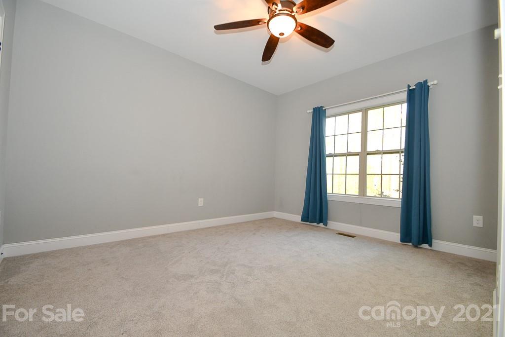 721 Roy Kindley Road Monroe, NC 28110 - Photo 17 of 32 a view of an empty room with a window