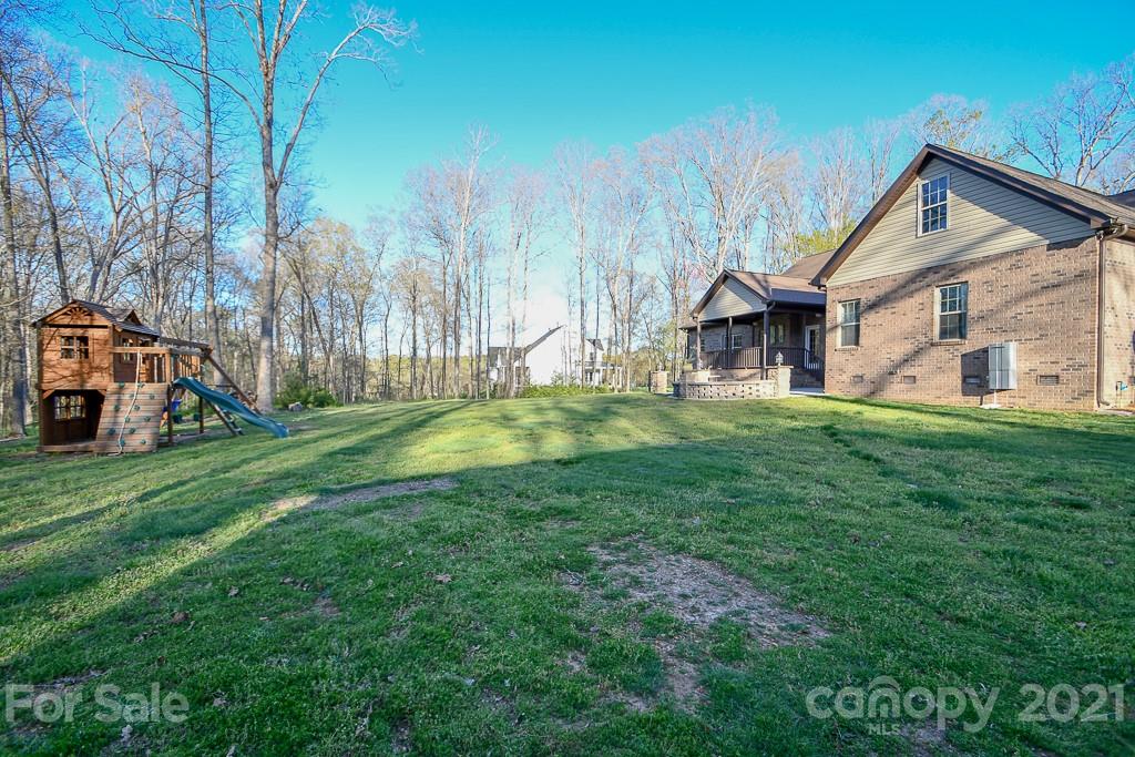 721 Roy Kindley Road Monroe, NC 28110 - Photo 3 of 32 a view of a house with a big yard and sitting area
