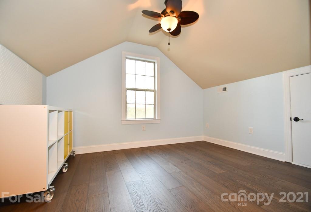 721 Roy Kindley Road Monroe, NC 28110 - Photo 25 of 32 wooden floor in an empty room with a window