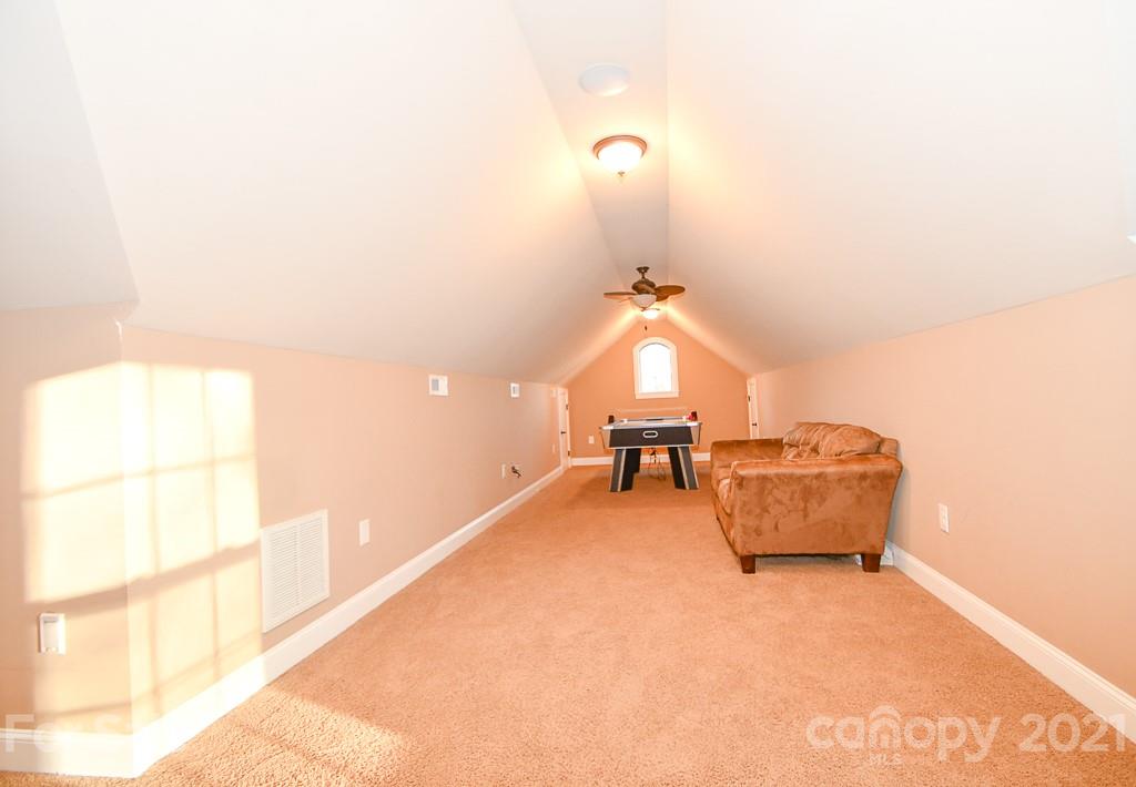 721 Roy Kindley Road Monroe, NC 28110 - Photo 26 of 32 a living room with furniture and a window