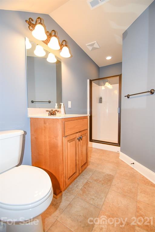 721 Roy Kindley Road Monroe, NC 28110 - Photo 29 of 32 a bathroom with a sink a toilet and a mirror