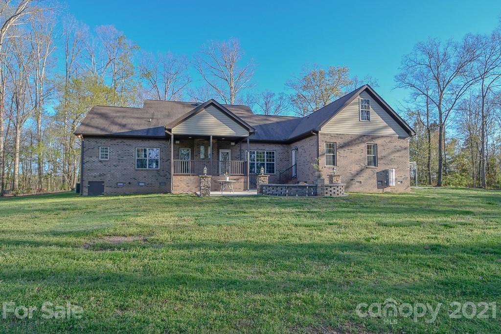 721 Roy Kindley Road Monroe, NC 28110 - Photo 4 of 32 a front view of a house with a garden