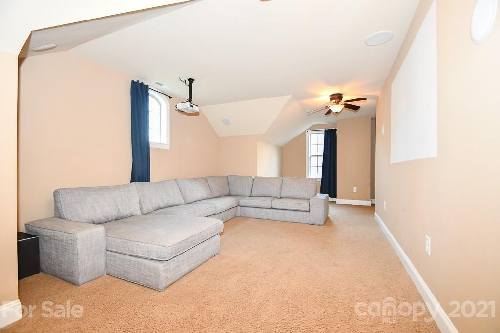 721 Roy Kindley Road Monroe, NC 28110 - Photo 31 of 32 a living room with furniture and white walls