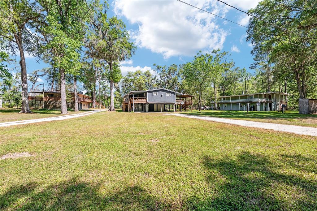 7870 Southwest 25th Place Bell, FL 32619 - Photo 25 of 99 a house view with swimming pool in front of it