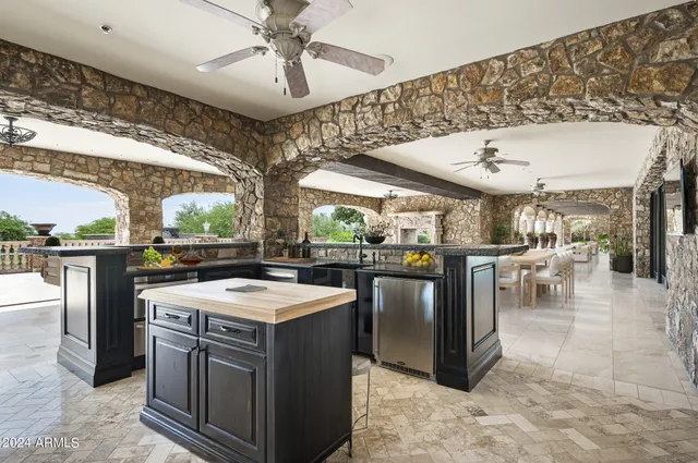 a dining hall with lots of tables and chairs