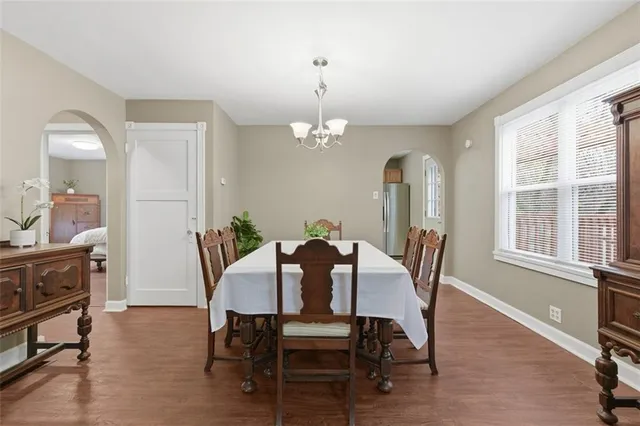 a view of a dining room with furniture and wooden floor