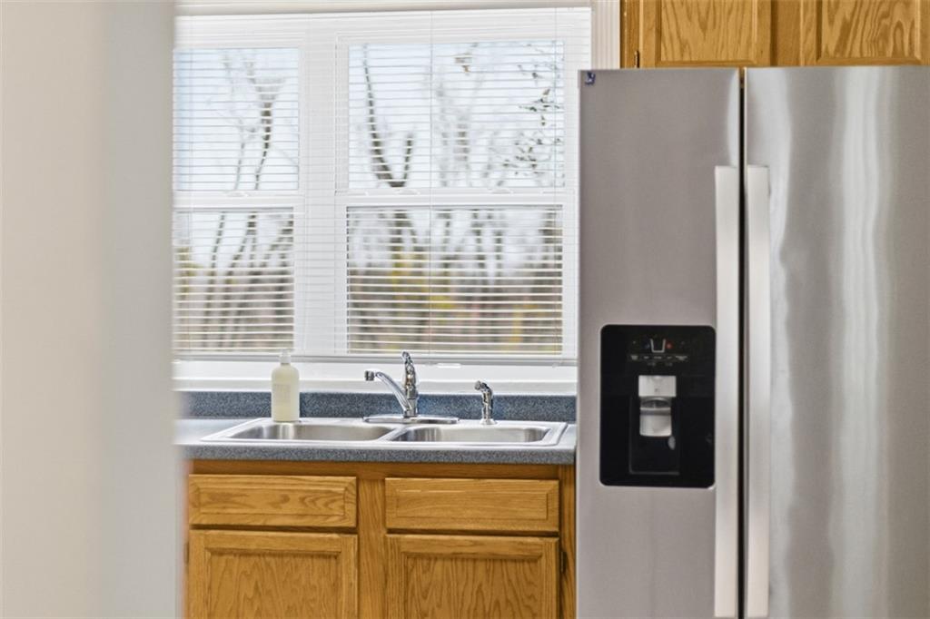 2609 Lah Road Gibsonia, PA 15044 - Photo 14 of 48 a kitchen with stainless steel appliances granite countertop a refrigerator and a sink