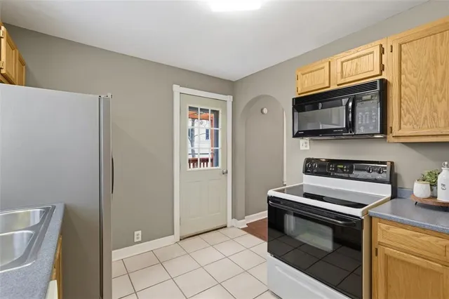 a bathroom with a double vanity sink and a window