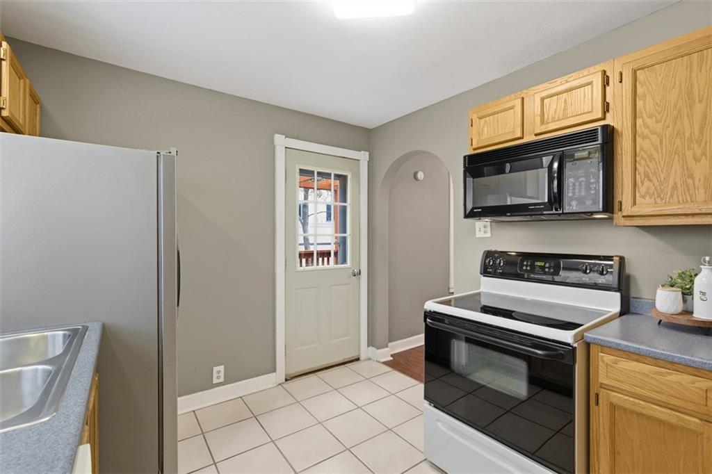 2609 Lah Road Gibsonia, PA 15044 - Photo 17 of 48 a kitchen with granite countertop cabinets stainless steel appliances and a sink