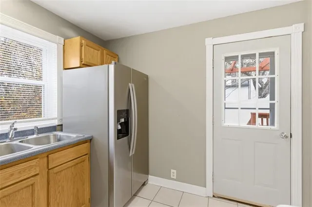 a kitchen with stainless steel appliances granite countertop a stove microwave and cabinets