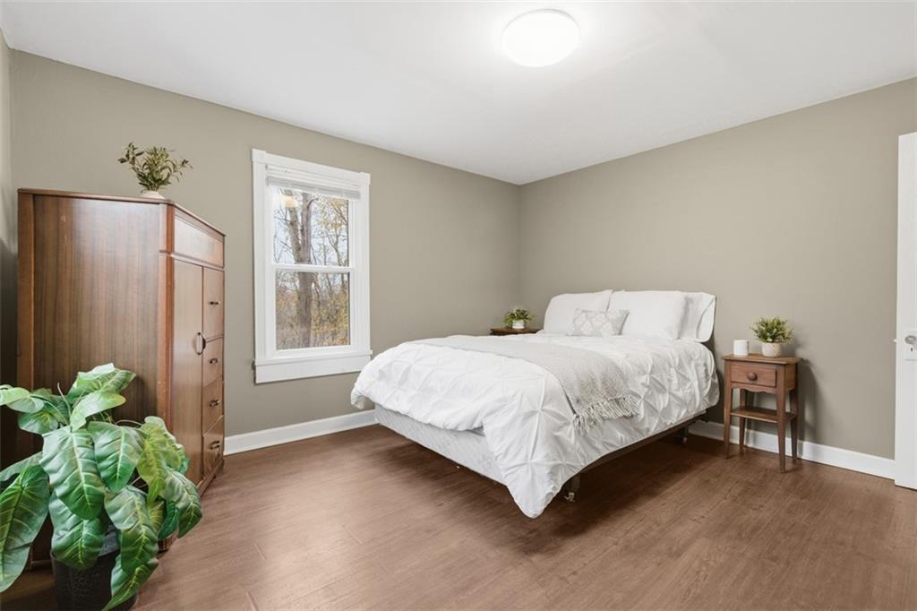 2609 Lah Road Gibsonia, PA 15044 - Photo 21 of 48 a bedroom with a bed potted plant and a window