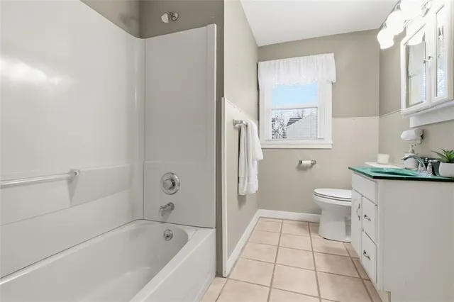 a bathroom with a bathtub toilet and sink