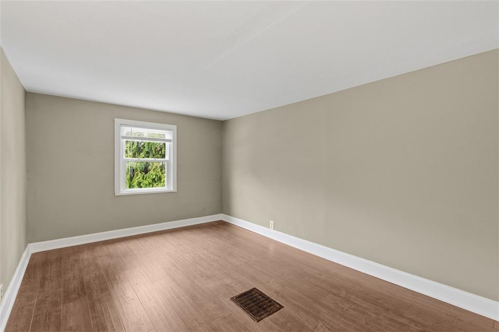 2609 Lah Road Gibsonia, PA 15044 - Photo 32 of 48 an empty room with wooden floor and windows